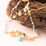 Pulsera de Pajaritos de color oro y aguamarinas